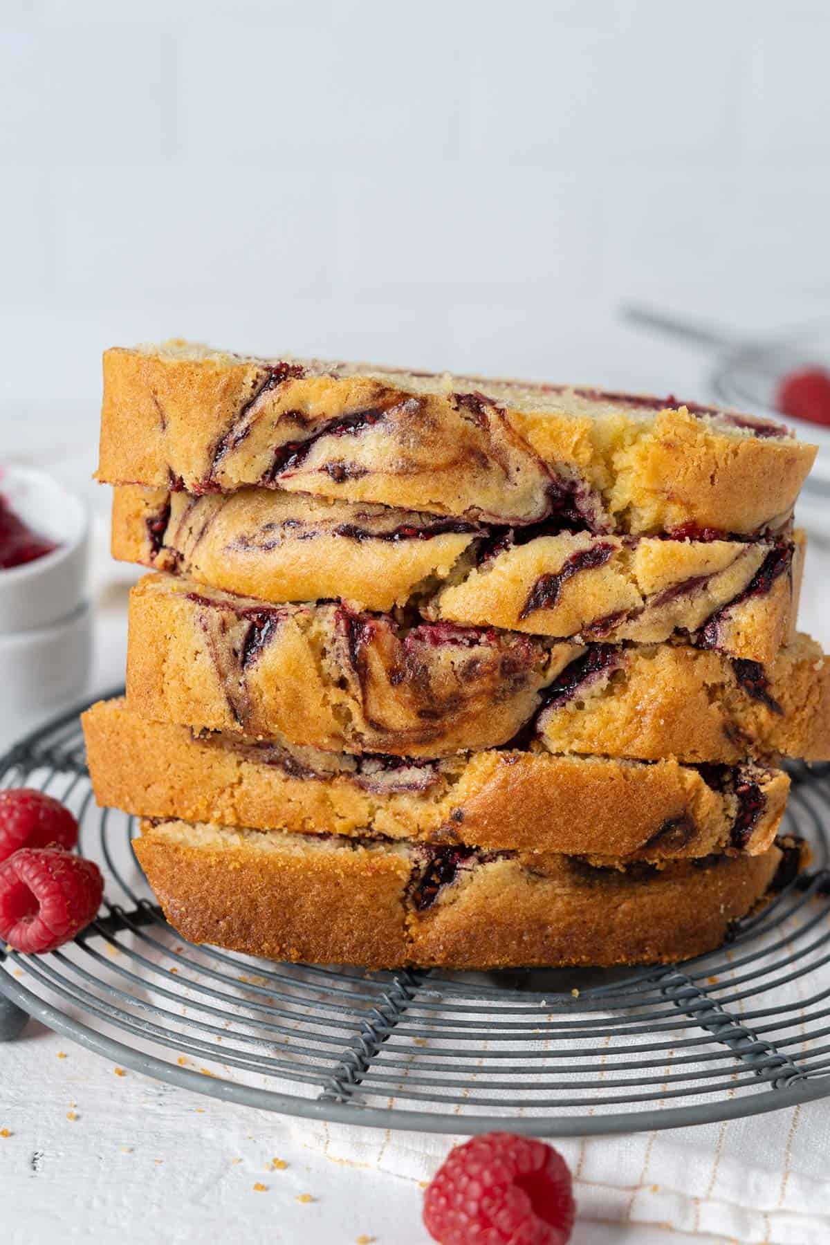 Stacked slices of healthy olive oil raspberry swirl cake