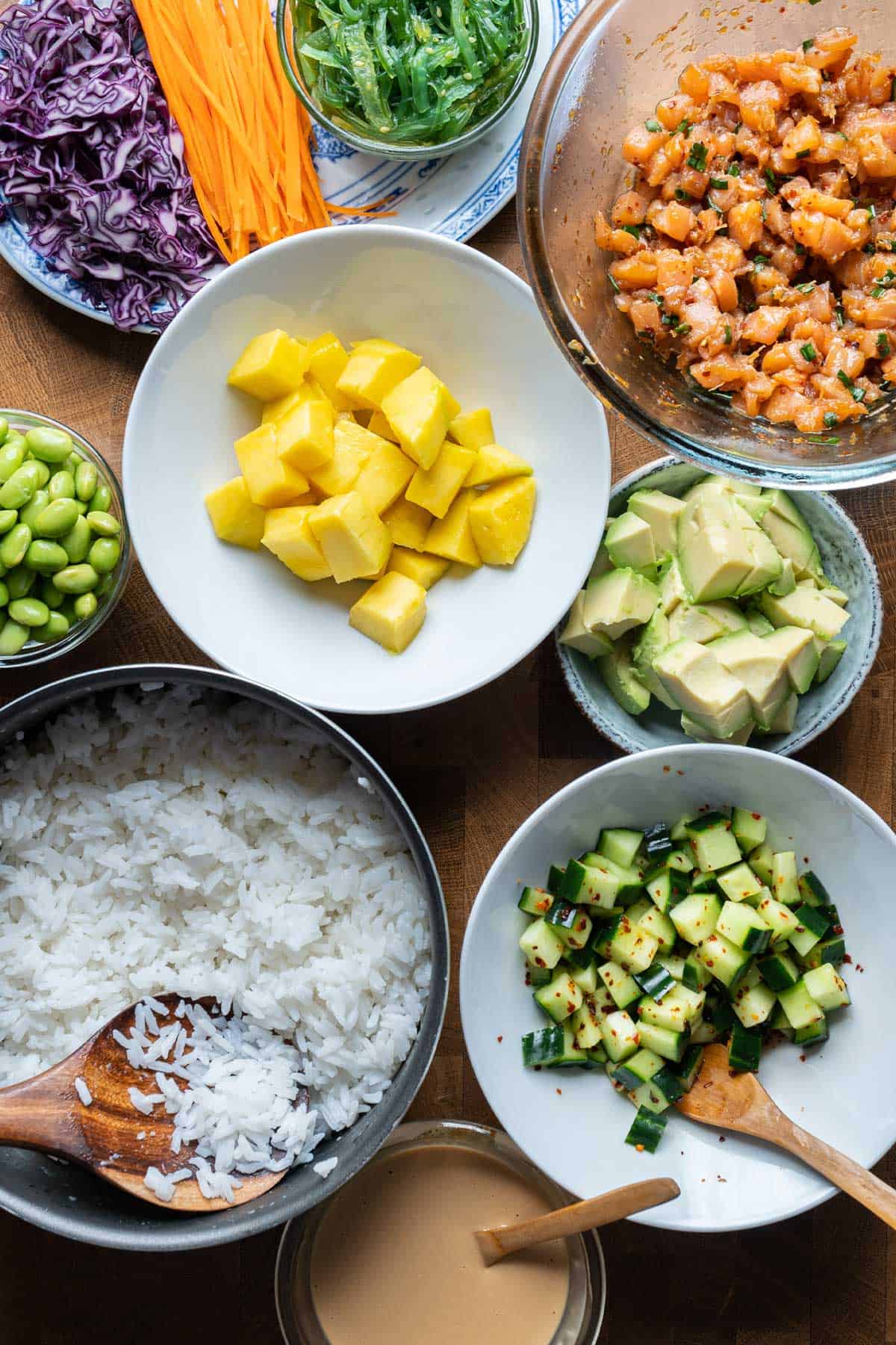 Each component for spicy salmon poke bowl.