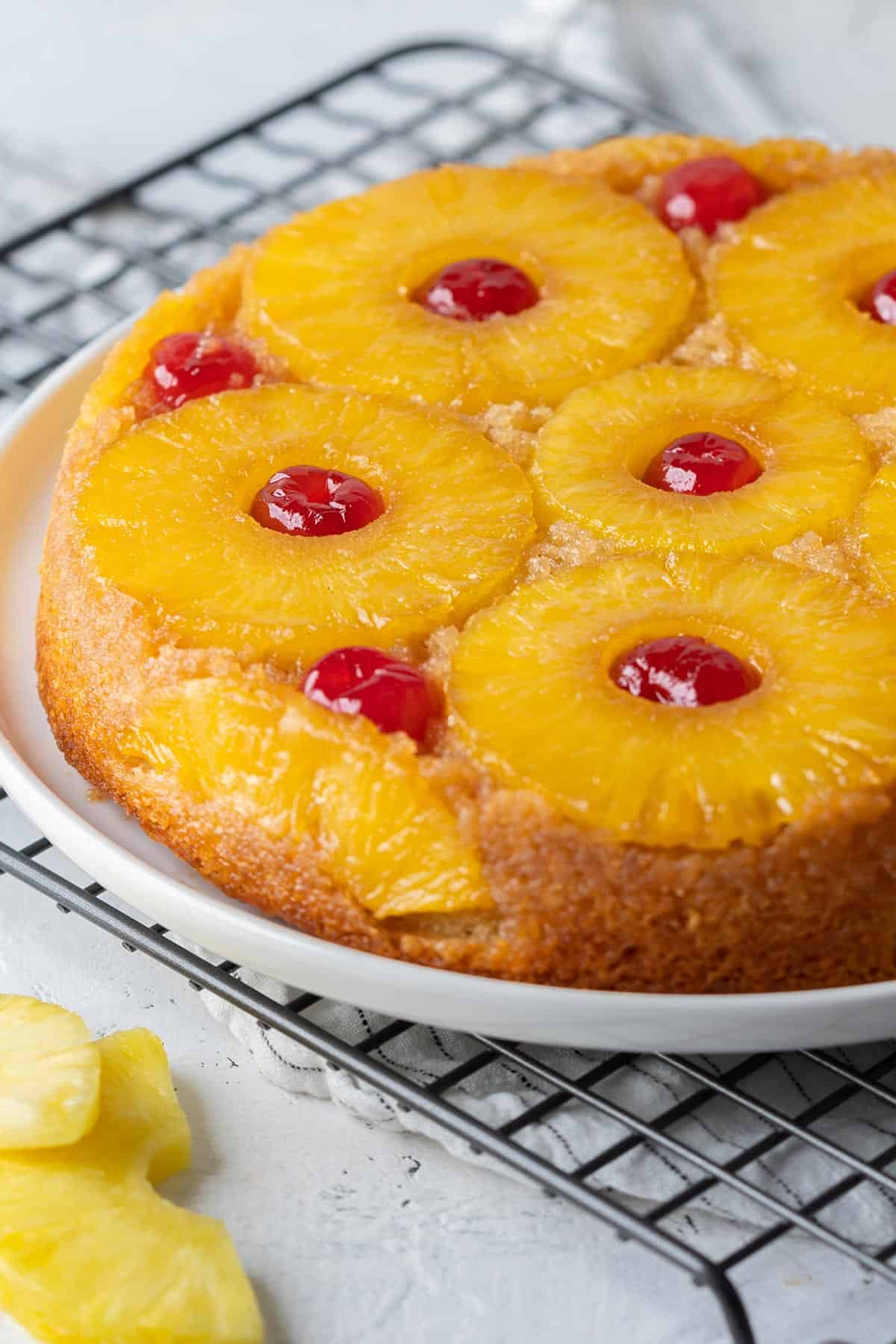 Healthy pineapple upside down cake in a plate view from front.