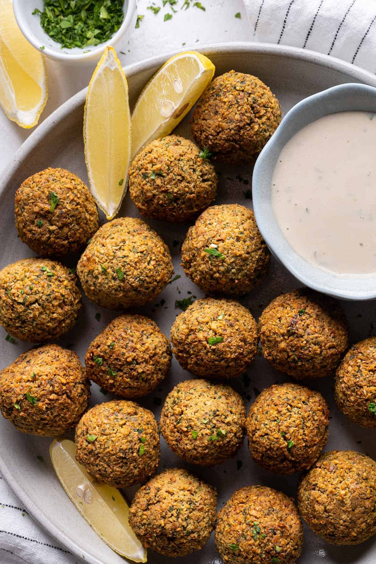 Crispy air-fryer falafel in a plate view from top.