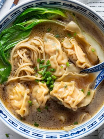 Wonton noodle soup in a bowl view from up