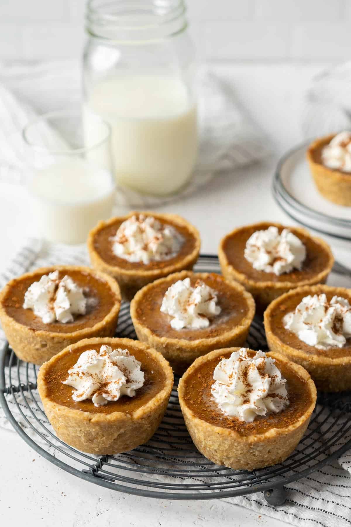 Healthy mini pumpkin pies on a cooling rack.