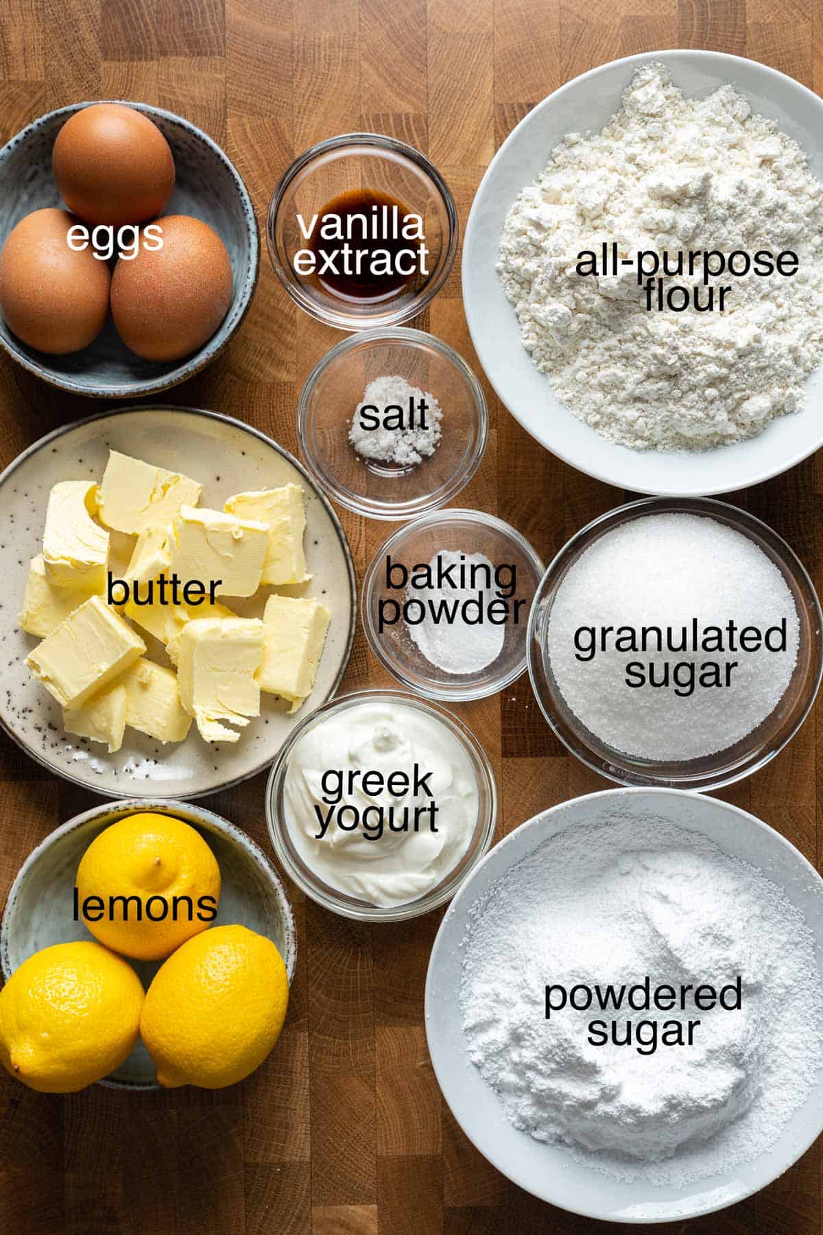 Ingredients to make lemon loaf cake with icing.