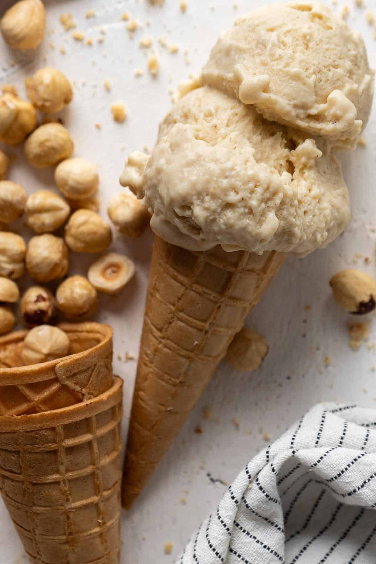 Ice cream with hazelnuts around it.