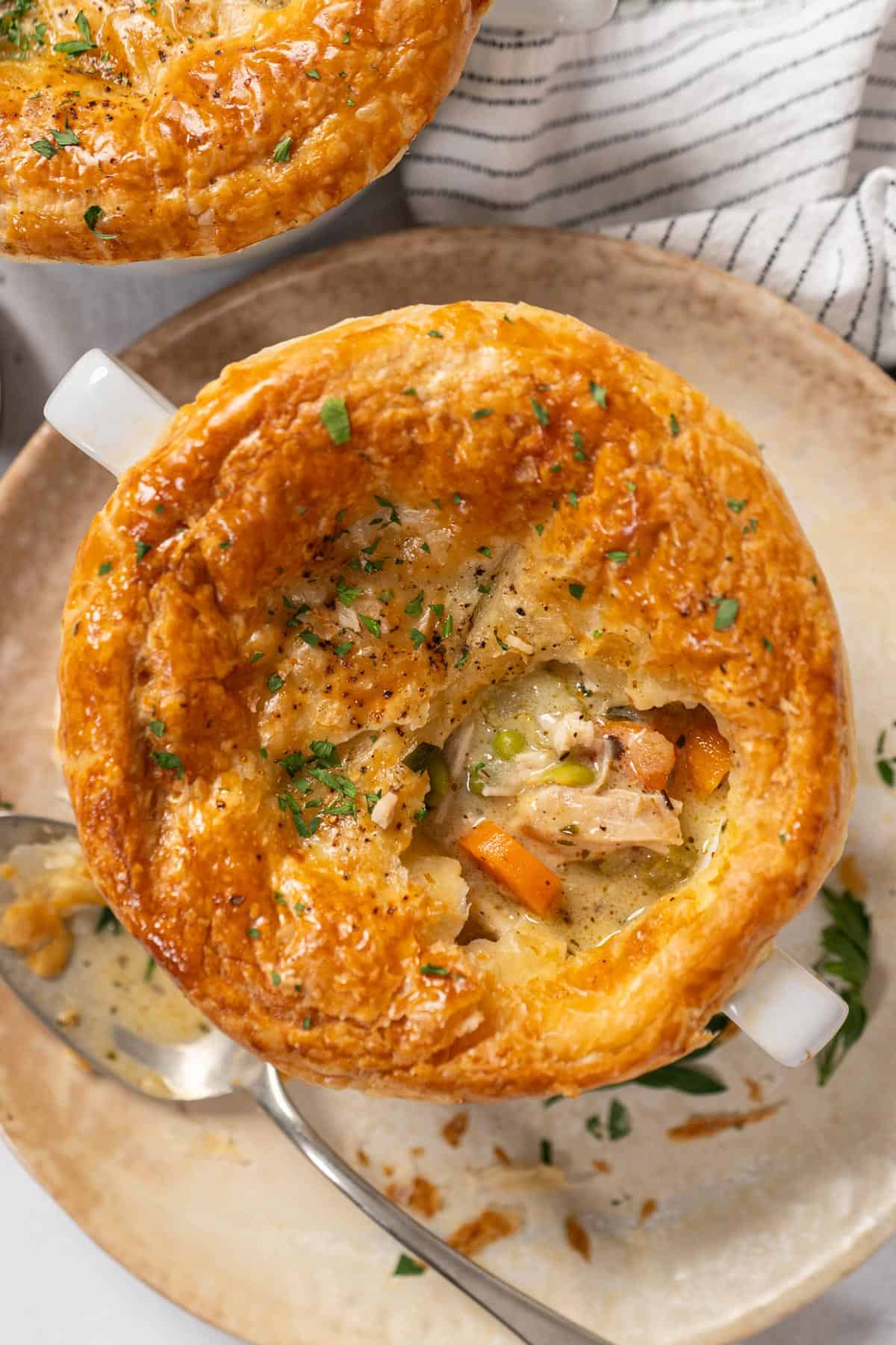 A bowl of half-eaten chicken pot pie.