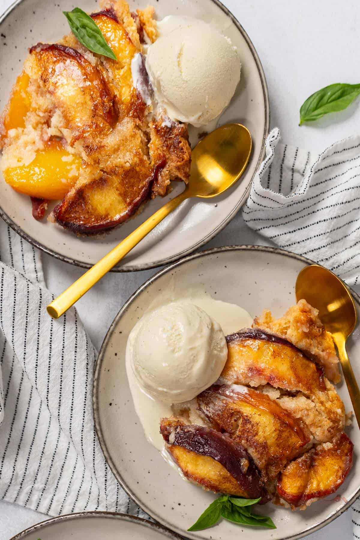 Peach cobbler served in two individual plates.