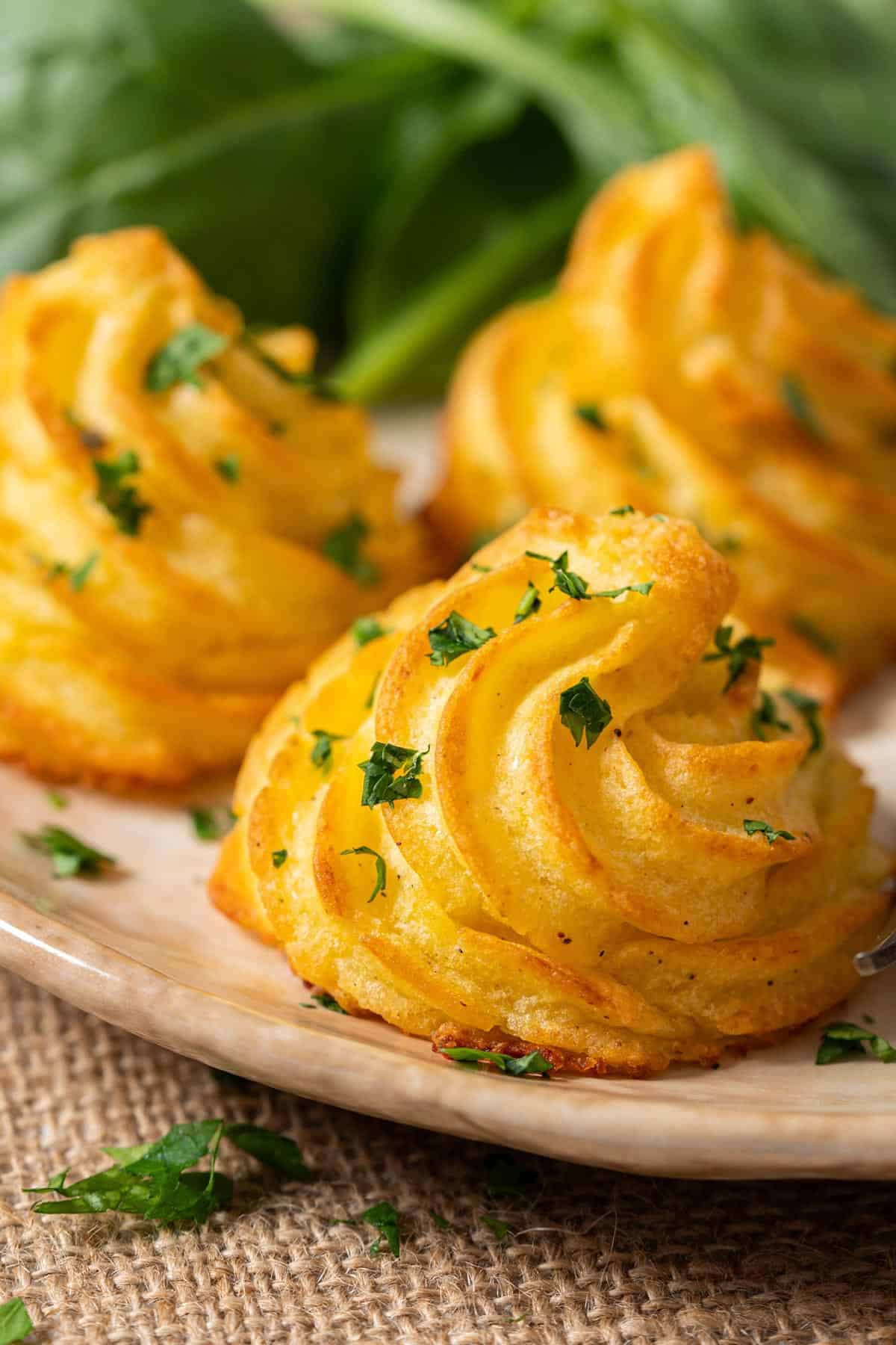 Close-up of parmesan Duchess potatoes.