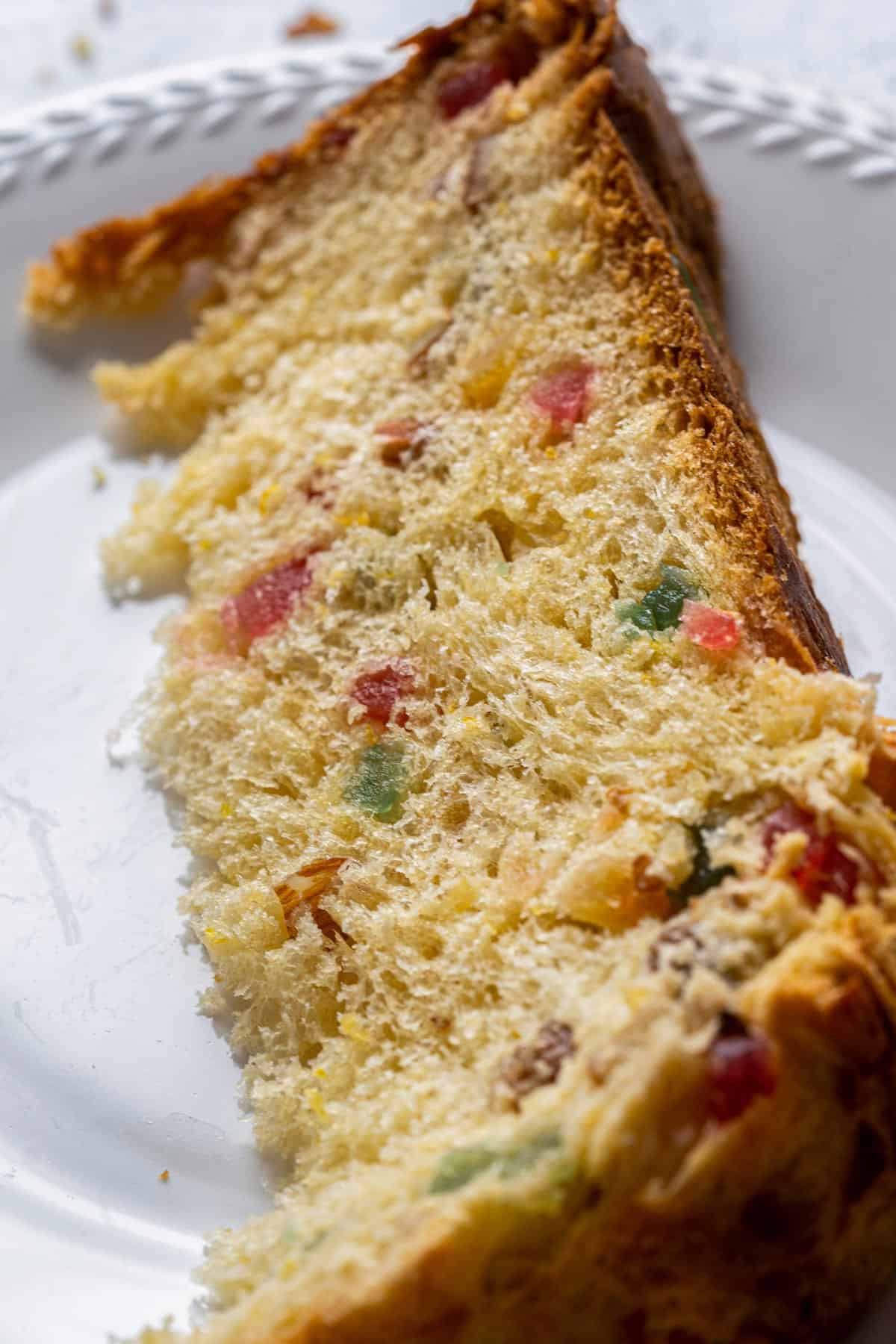 A slice of panettone bread on a plate.