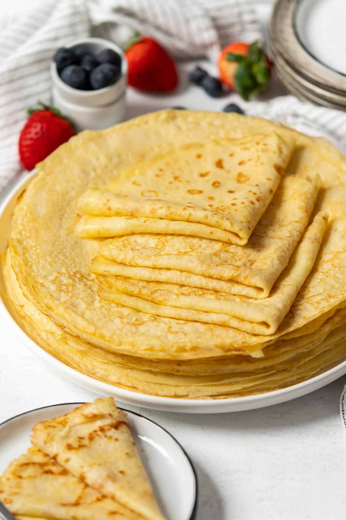 Crepes stacked in a plate.