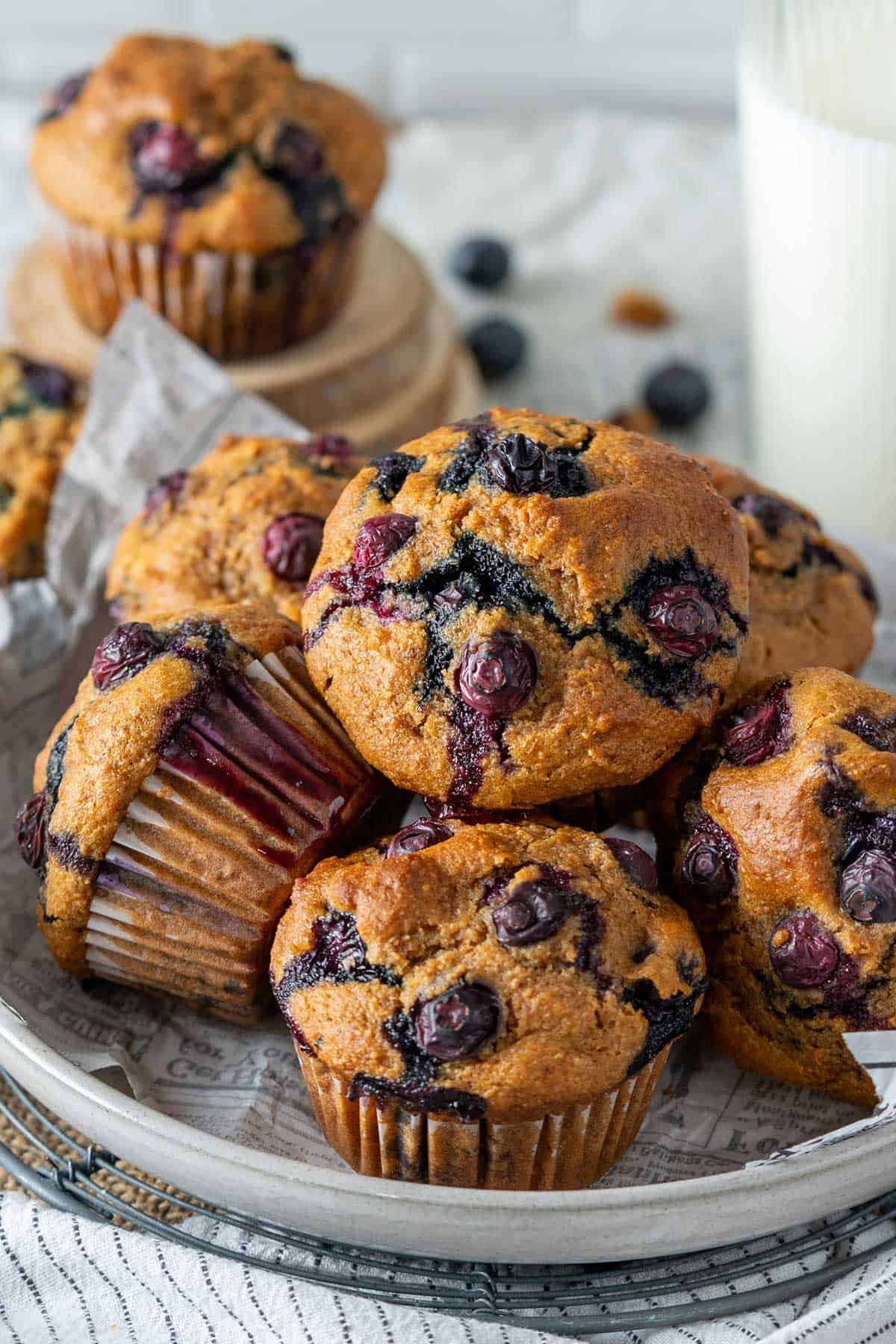 Blueberry protein muffins on a cooling rack.