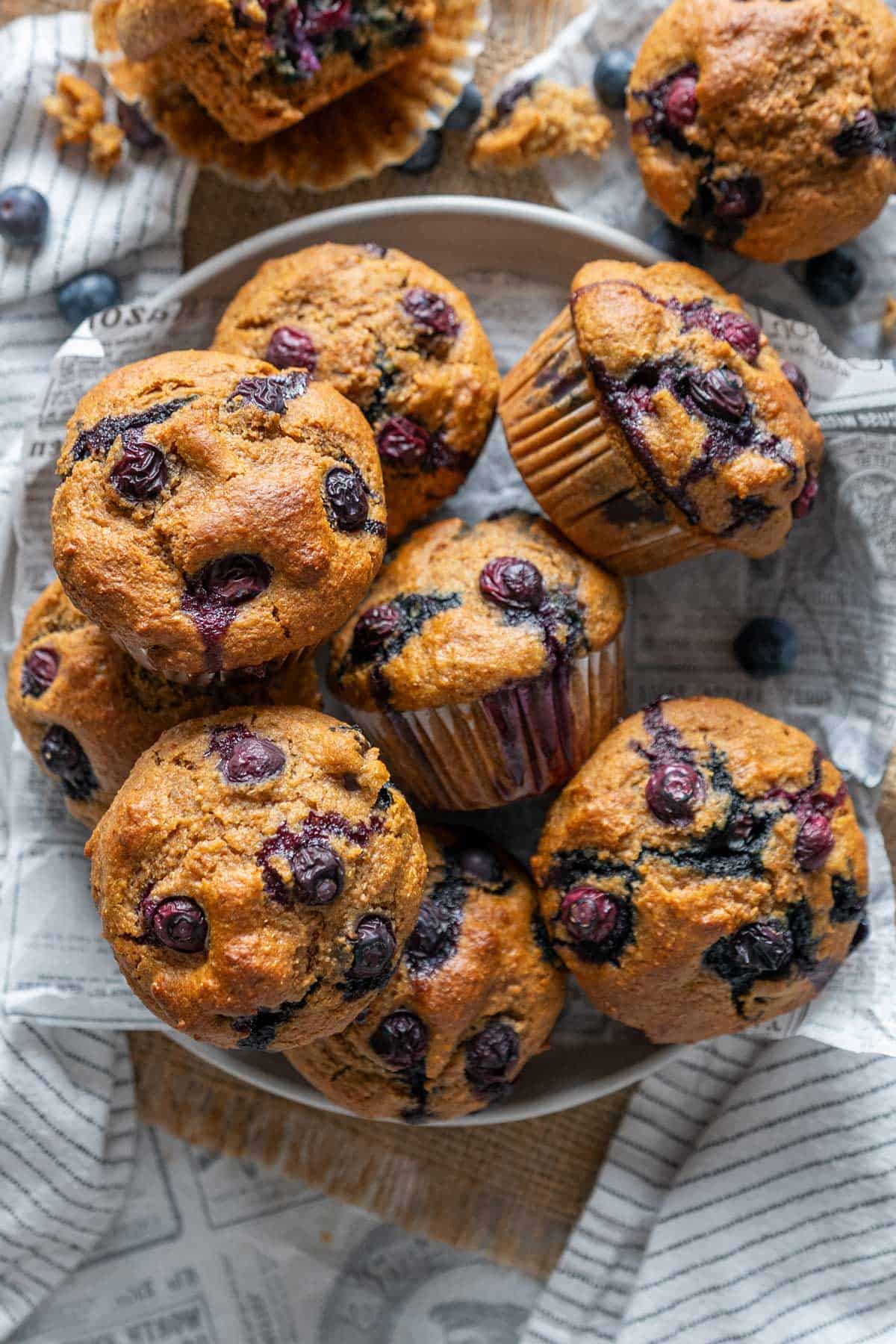 Blueberry protein muffins on a cooling rack.