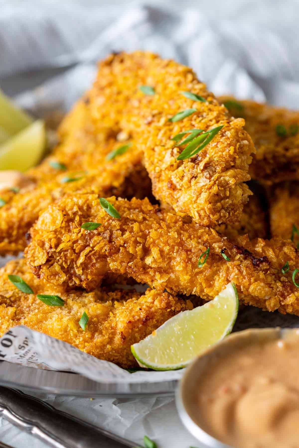 Air fryer bang bang chicken piled on a plate.