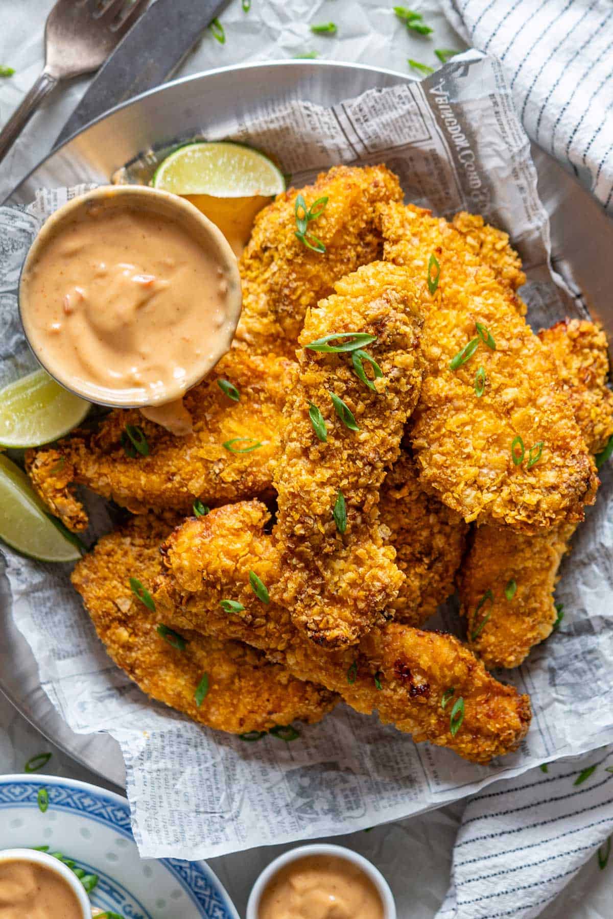 Air fryer bang bang chicken with sauce served on a plate.