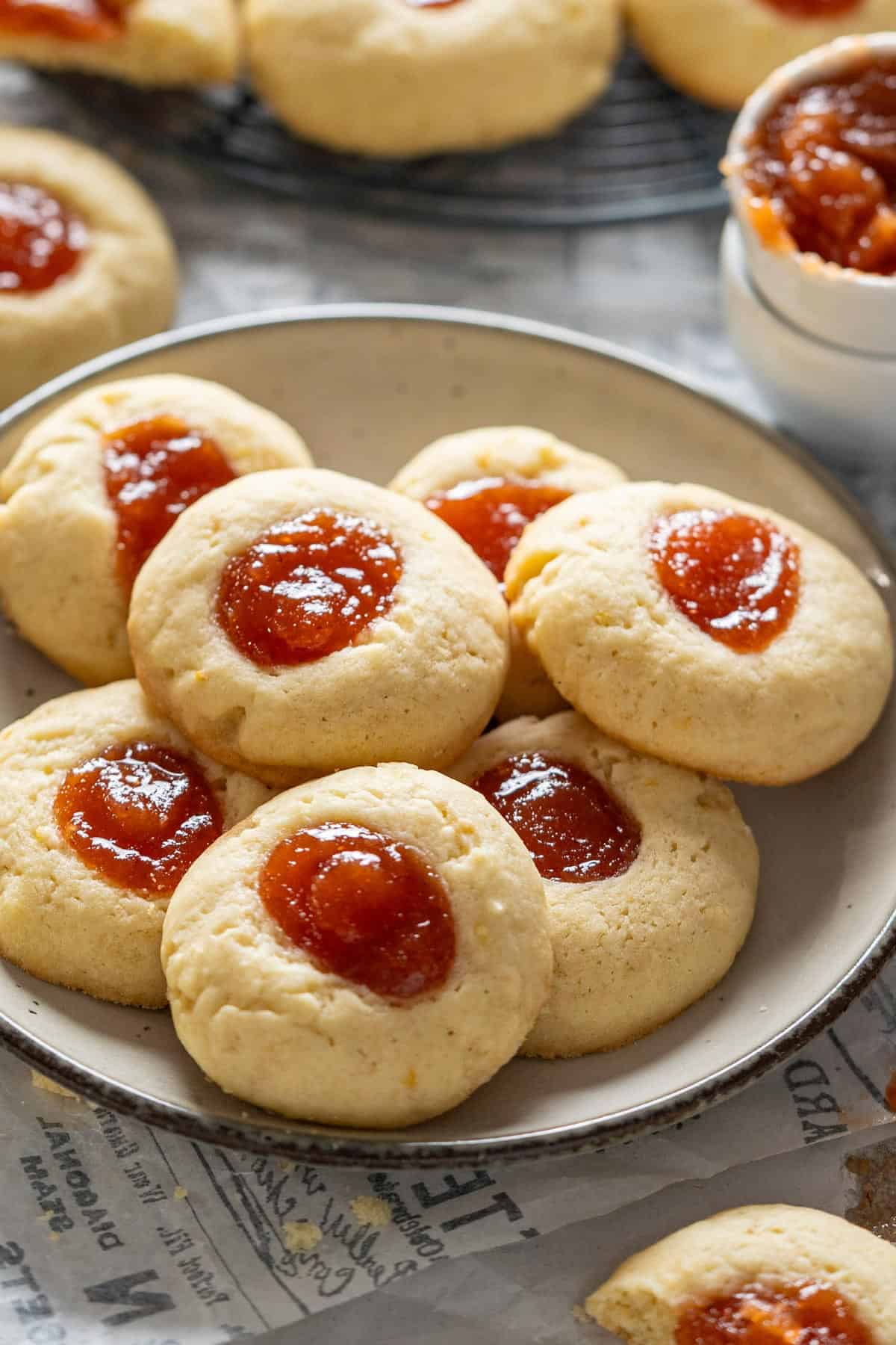 Argentine quince thumbprint cookies on a plate.