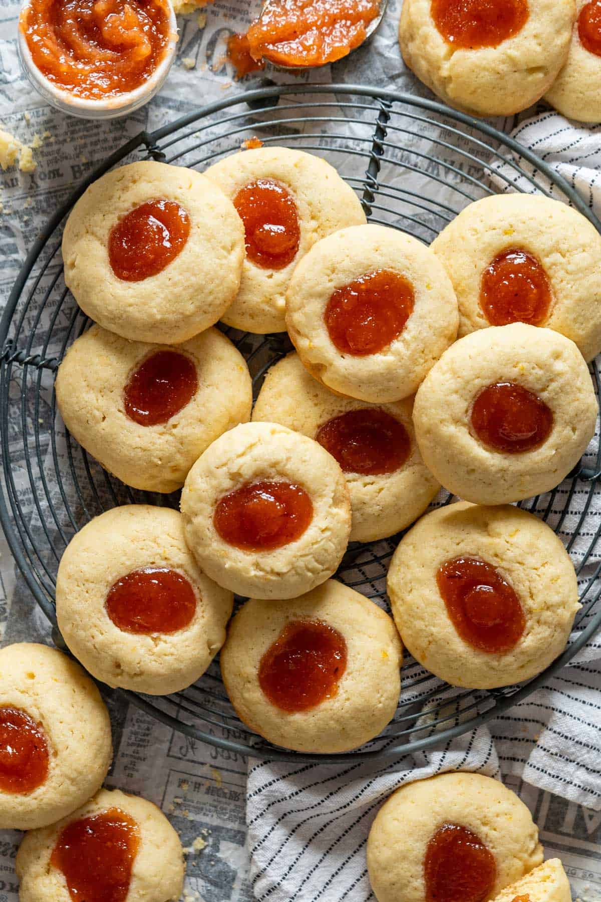 Argentine quince thumbprint cookies on a cooling rack.