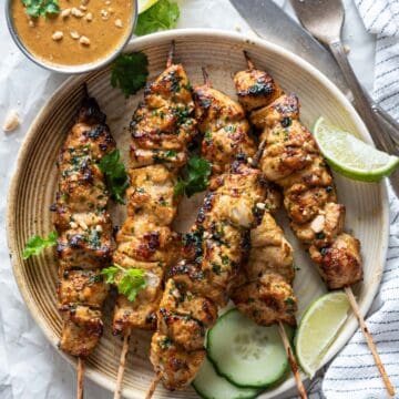 Air fryer chicken skewers with peanut sauce.