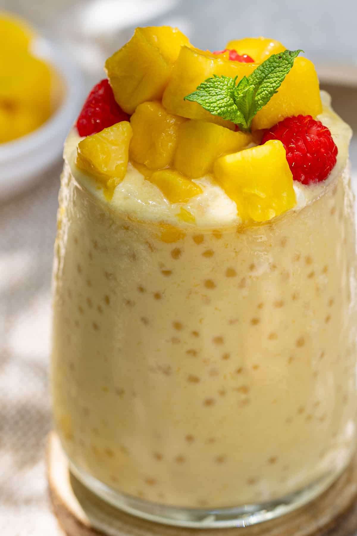 Close-up of mango coconut sago in a glass.