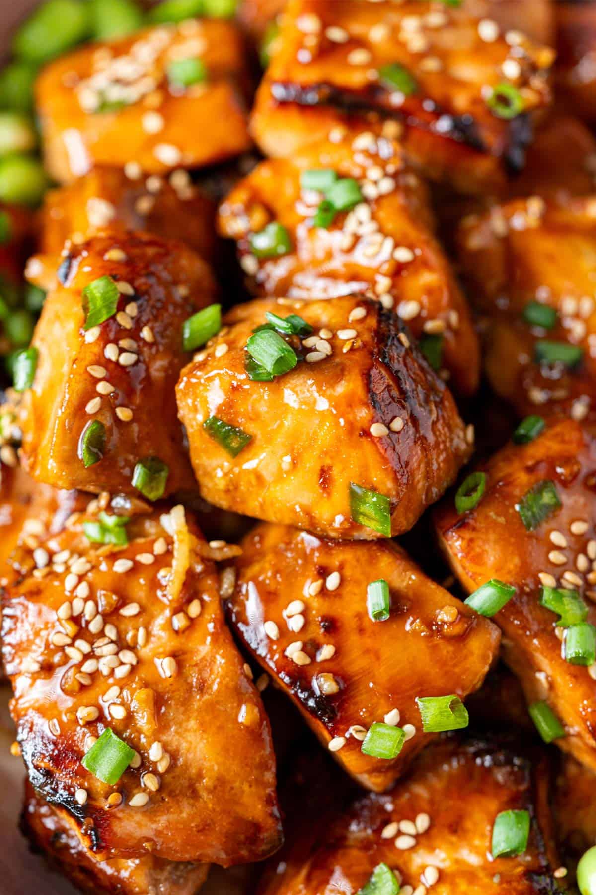 Close-up of teriyaki salmon bites.