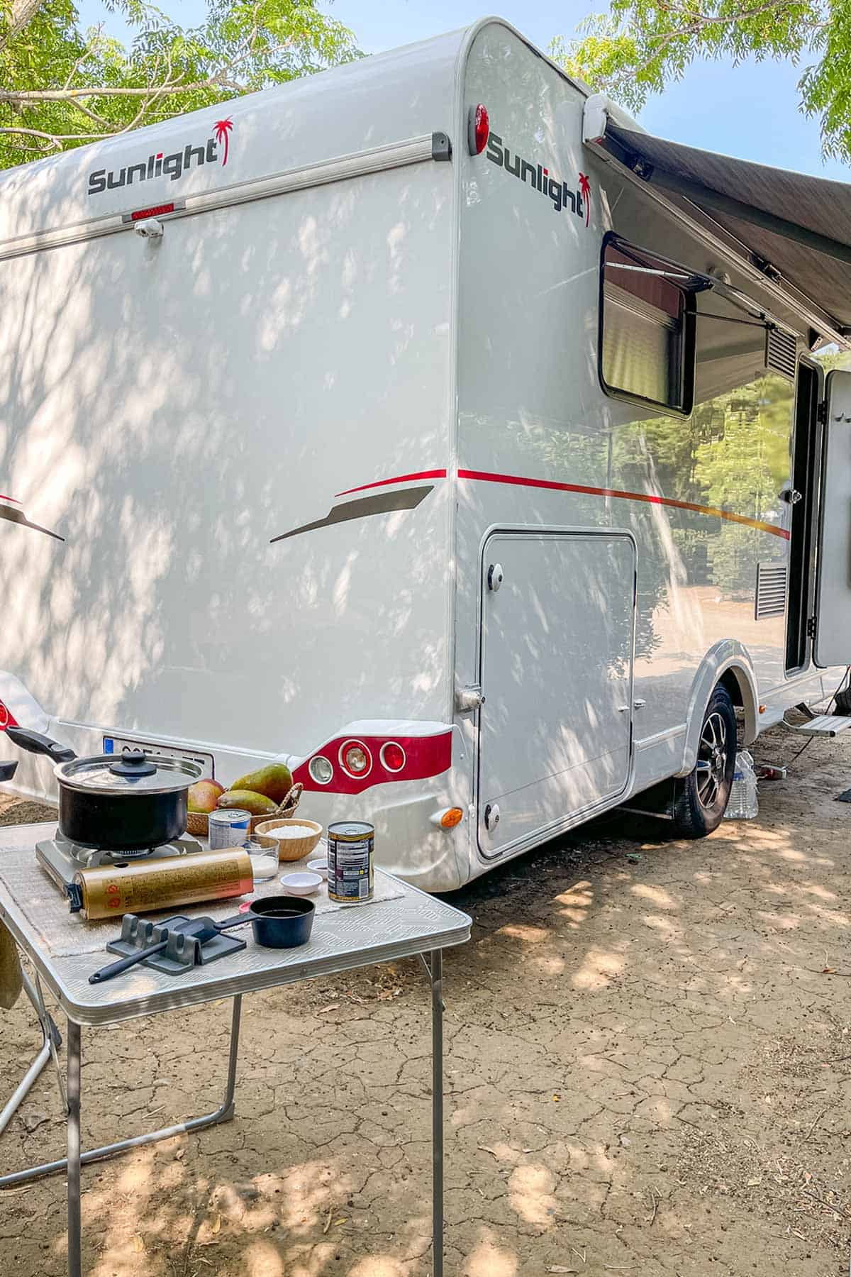 Ingredients for mango coconut sago on a camping table outside our motorhome.