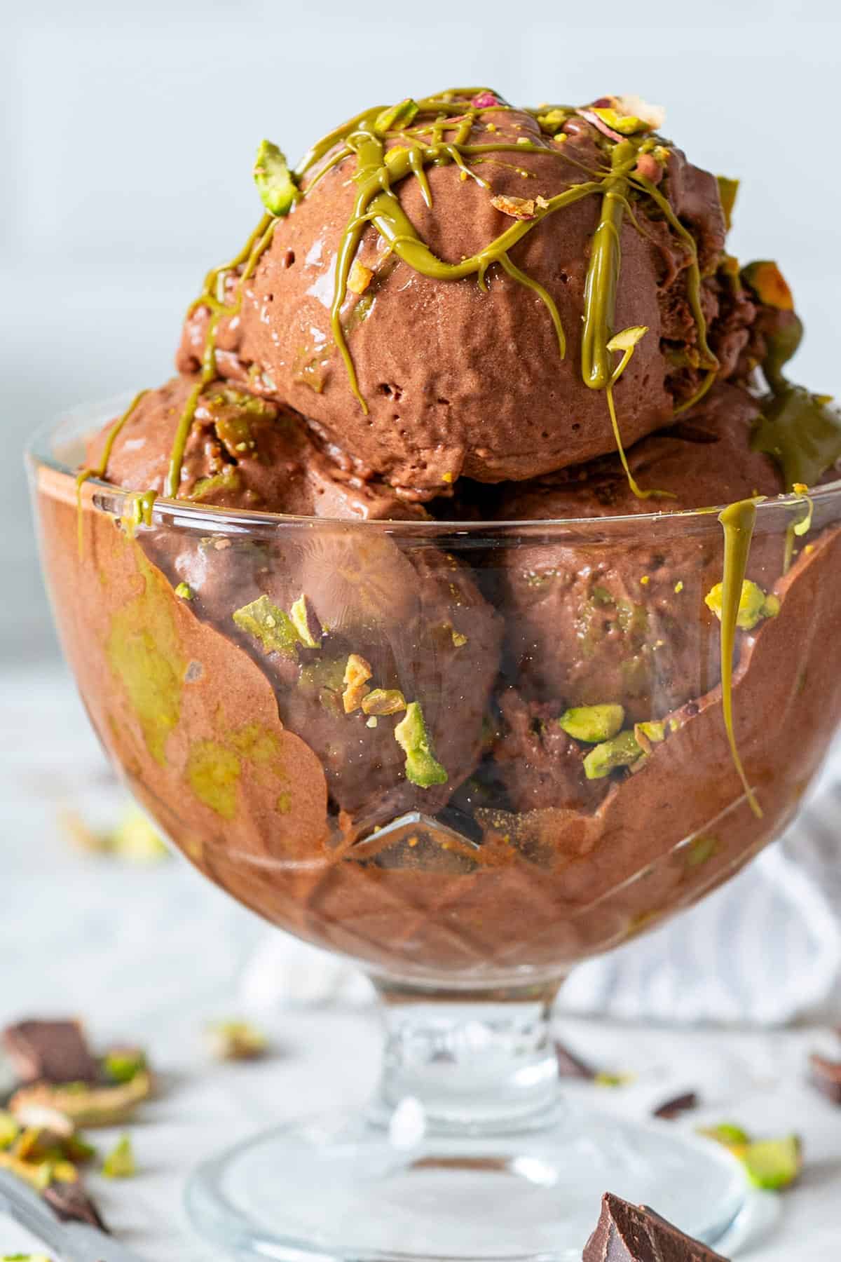 Scooped chocolate ice cream in a bowl.