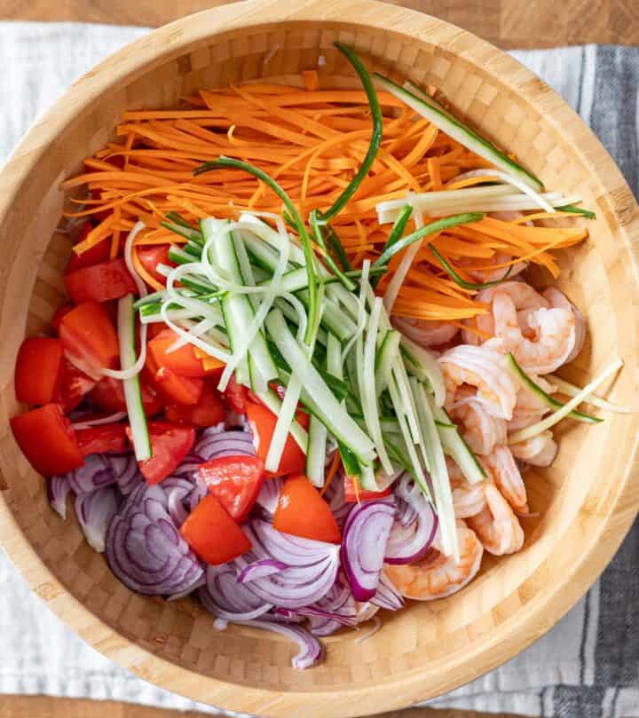 A bowl containing all of the glass noodle salad components.