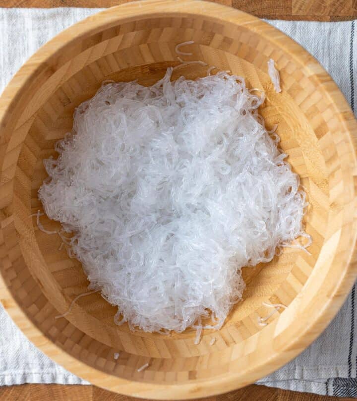 A bowl containing cooked glass noodles.