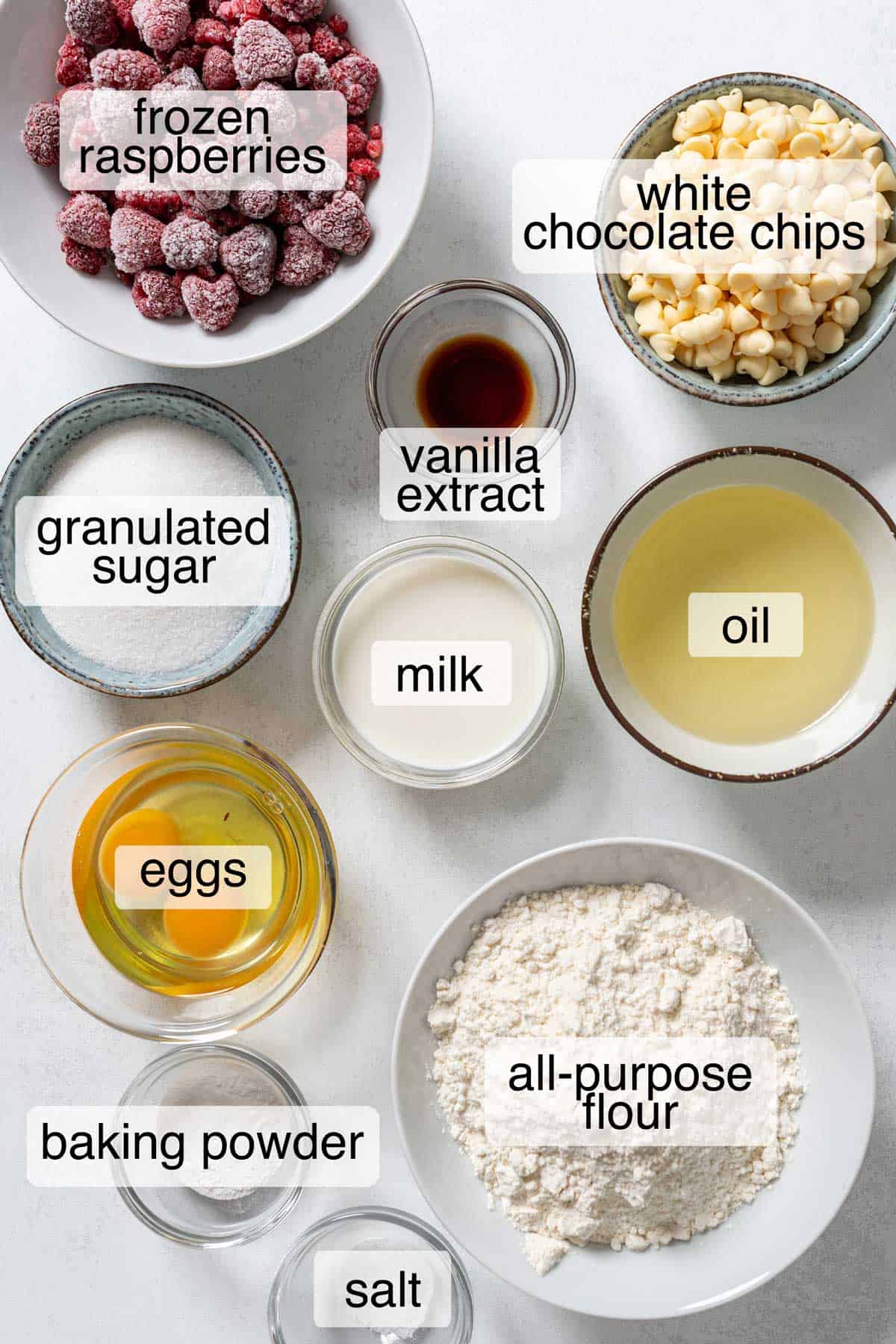 Ingreidents to make raspberry and white chocolate muffins.