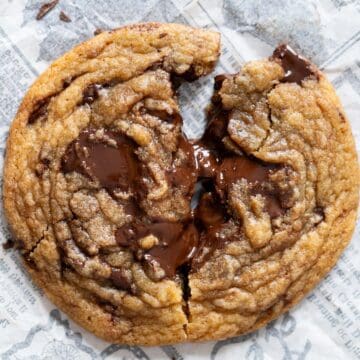 Chewy chocolate chunk cookie broken in half.