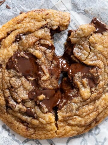 Chewy chocolate chunk cookie broken in half.