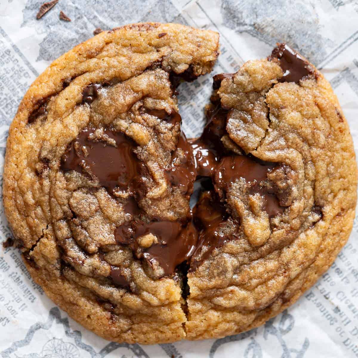 Chewy chocolate chunk cookie broken in half.