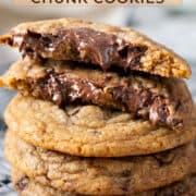 Chewy chocolate chunk cookies stacked.