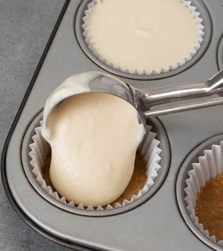 Filling the muffin tin.