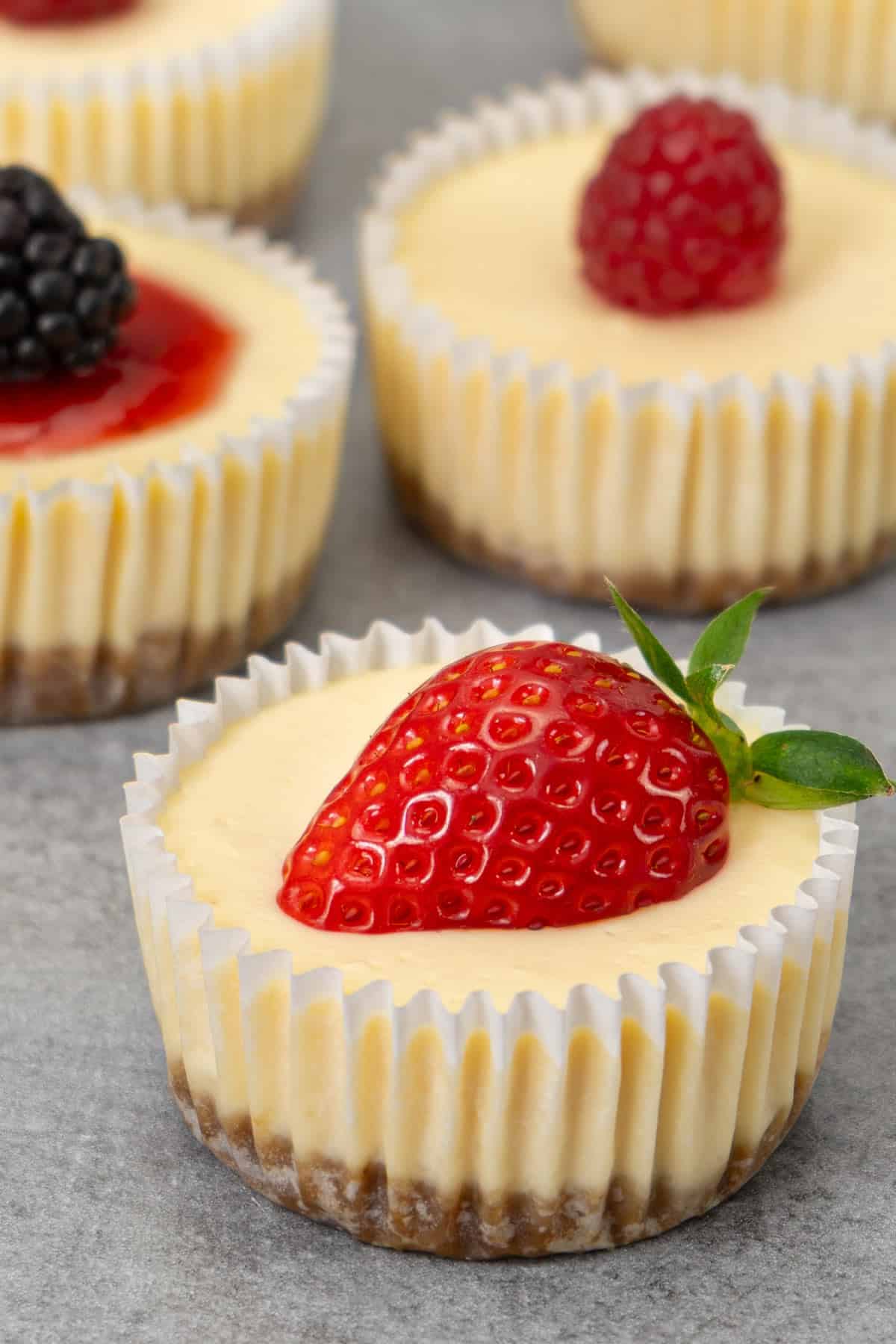 Mini cheesecakes with toppings.