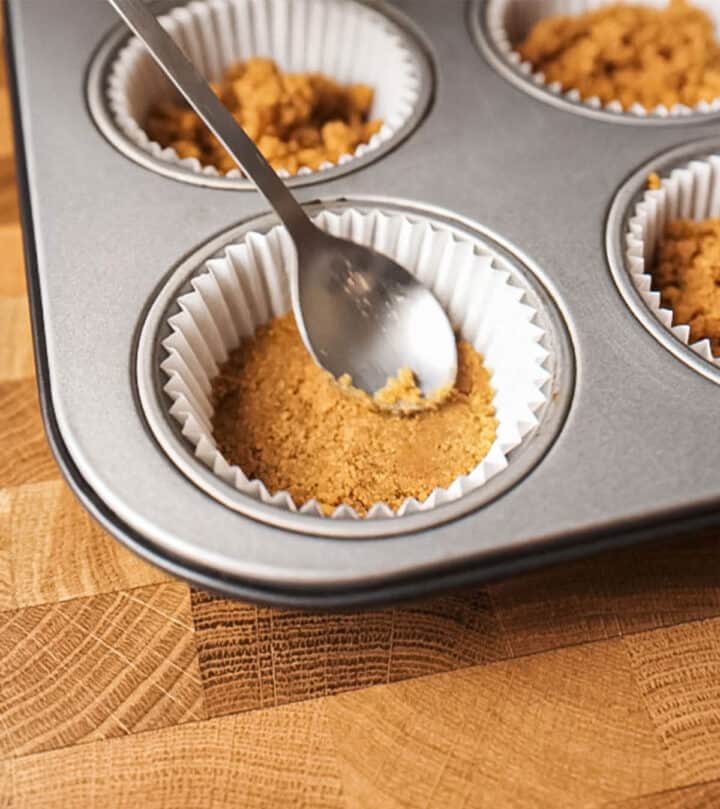 Pressing the cookie crumbs.