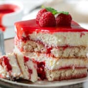 Raspberry tiramisu on a plate showing its light and. creamy texture.