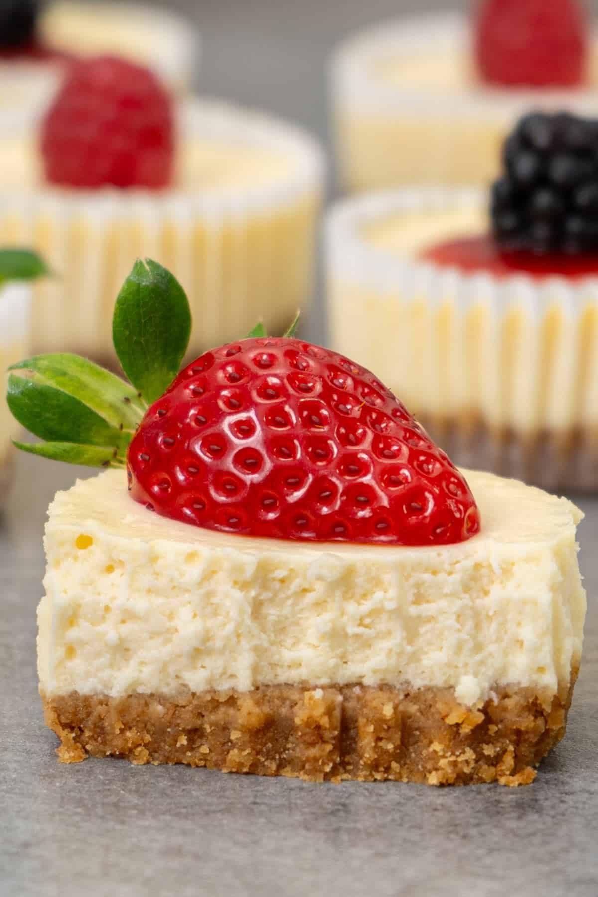 Showing the creamy texture of one mini cheesecake.