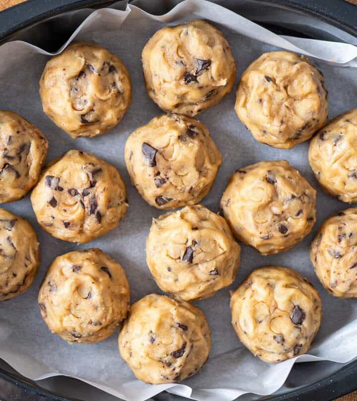 Chilling shaped cookie dough pucks before baking.