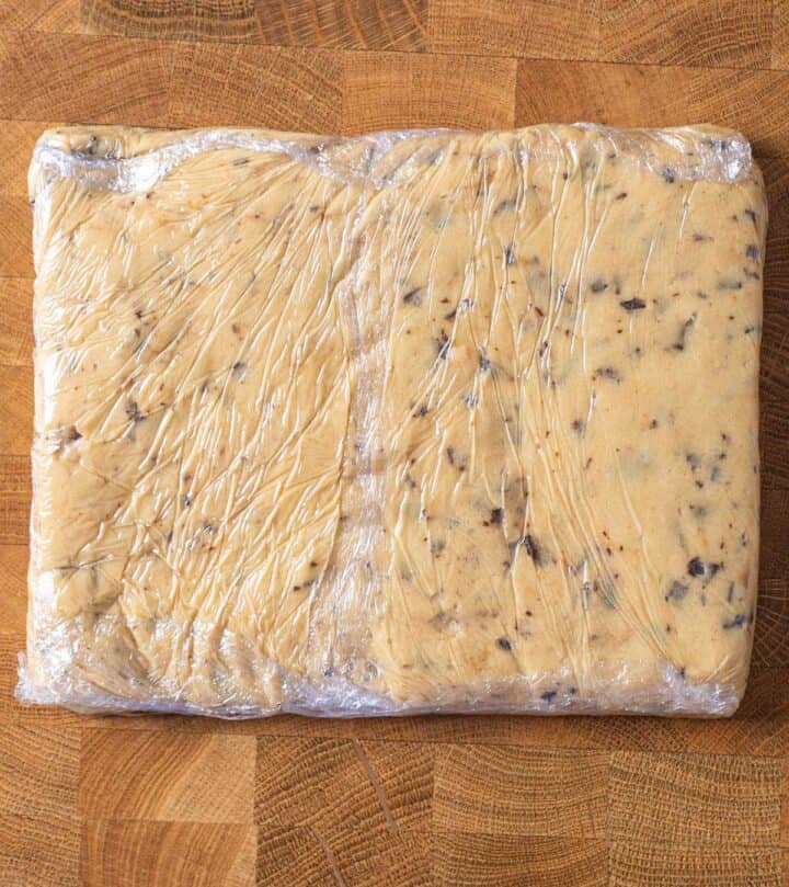 Cookie dough pressed into a rectangle slab before freezing.