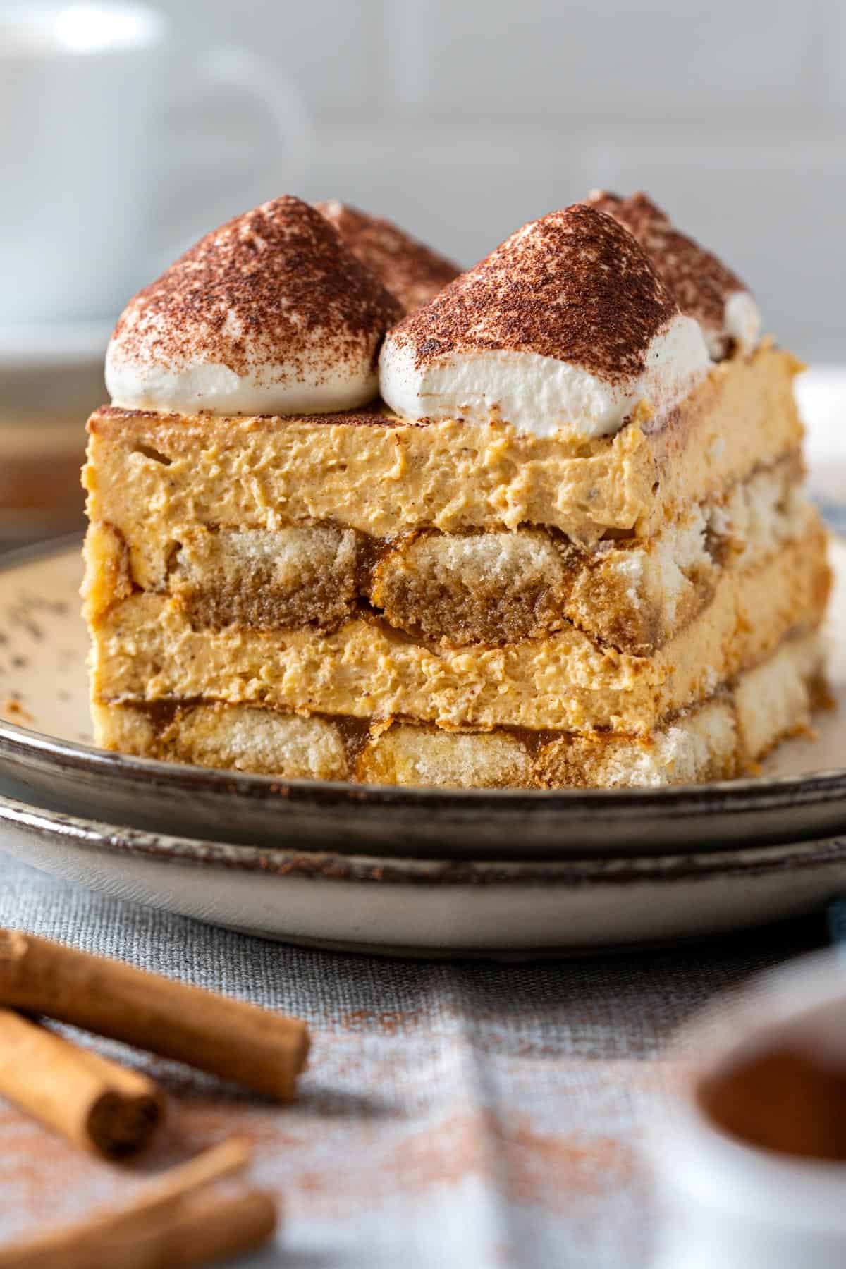 Egg free pumpkin tiramisu slice on a plate.