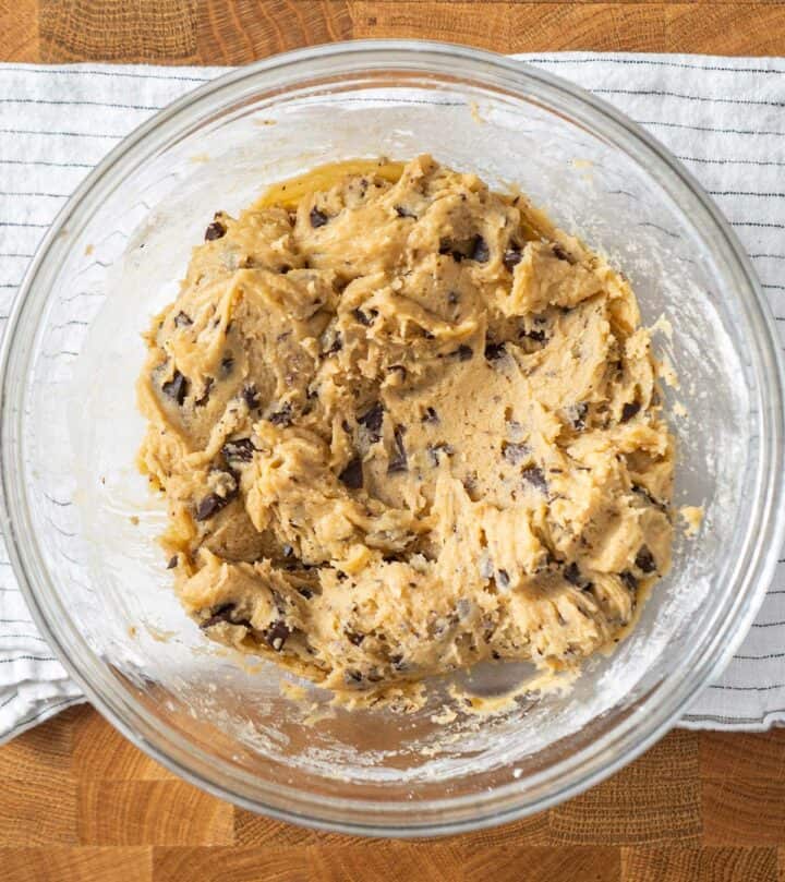 Mixed cookie dough with melted butter, sugars, and chocolate chunks.