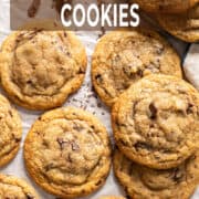 Nutella-stuffed cookies with chocolate chunks on parchment paper.