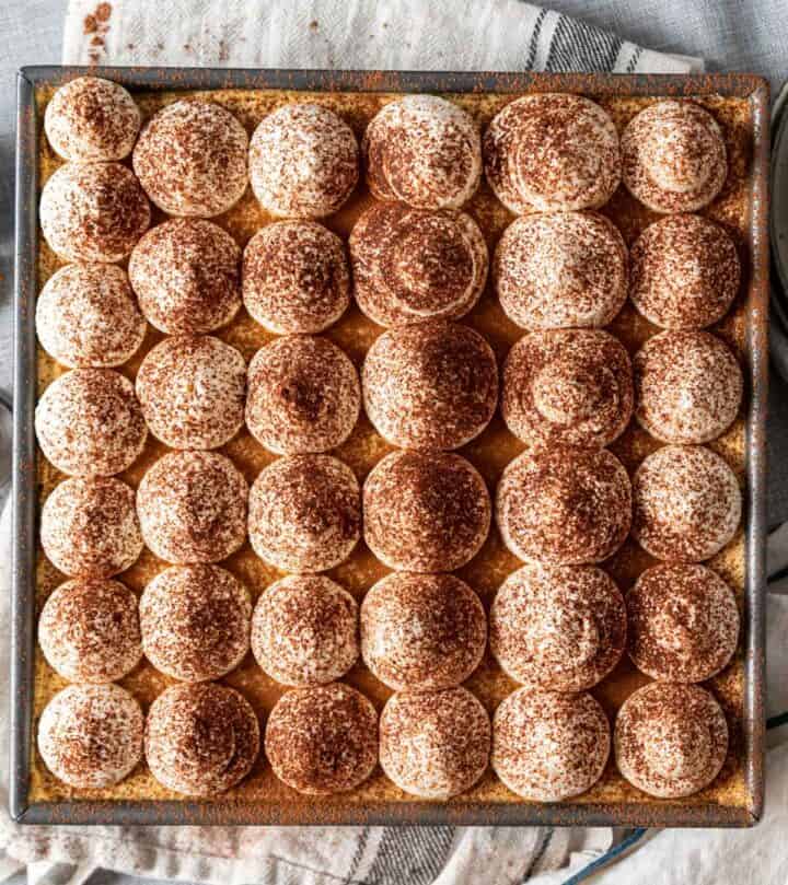 Pumpkin tiramisu with dollops of cream.