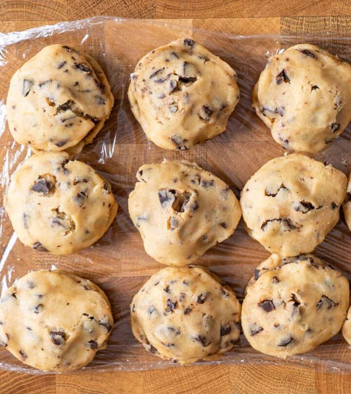 Sealing cookie dough around Nutella filling to form a puck.
