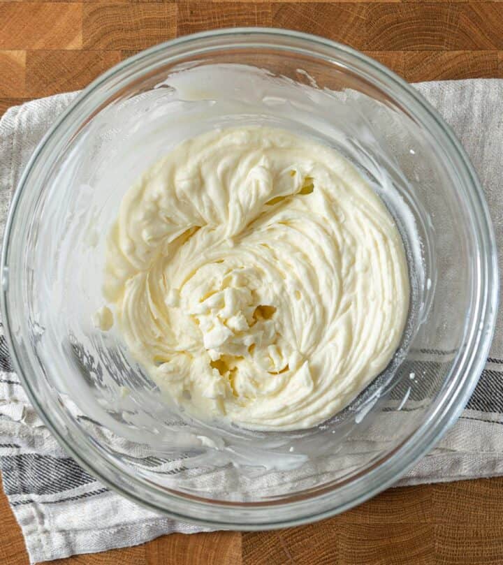 Whisked heavy cream in a bowl.