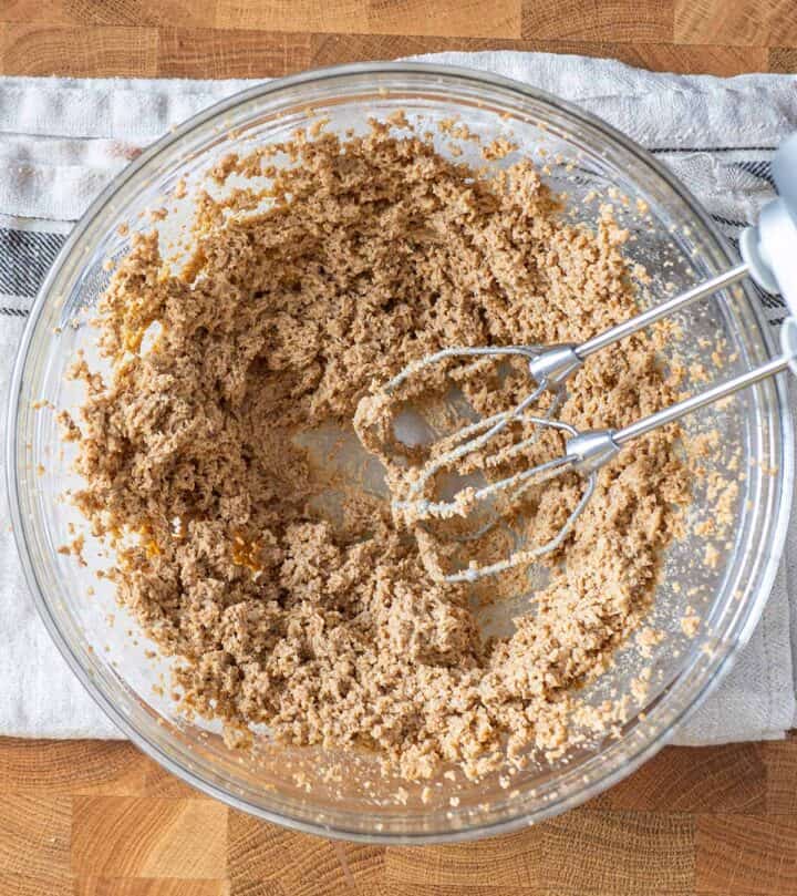 Beating butter and both sugars.