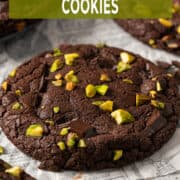 Chocolate pistachio cookies with gooey pistachio cream filling and fudgy brownie-style texture.