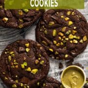 Chocolate pistachio cookies with gooey pistachio cream filling and fudgy brownie-style texture.