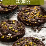 Chocolate pistachio cookies with gooey pistachio cream filling and fudgy brownie-style texture.