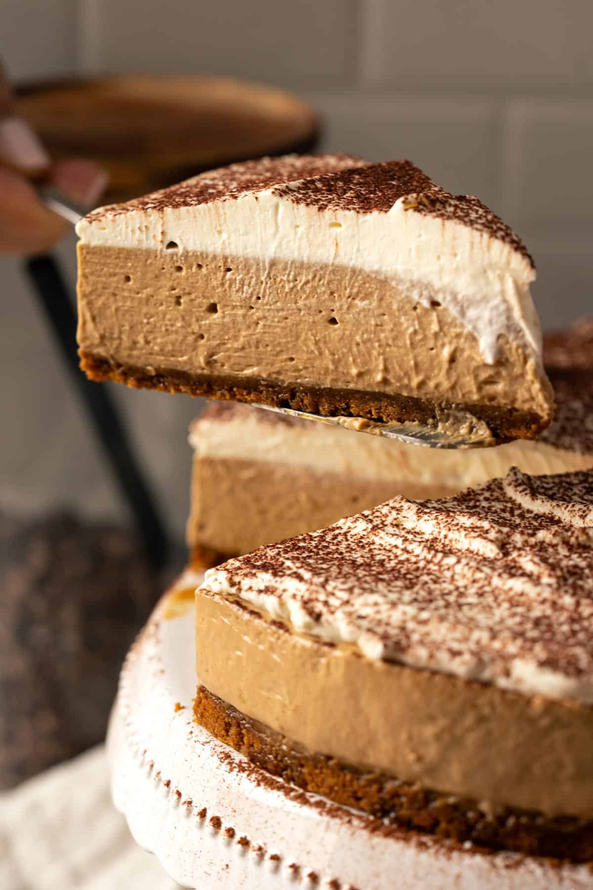 Lifting a slice of no-bake coffee cheesecake.