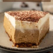 Showing the smooth and creamy texture of a slice of coffee cheesecake.